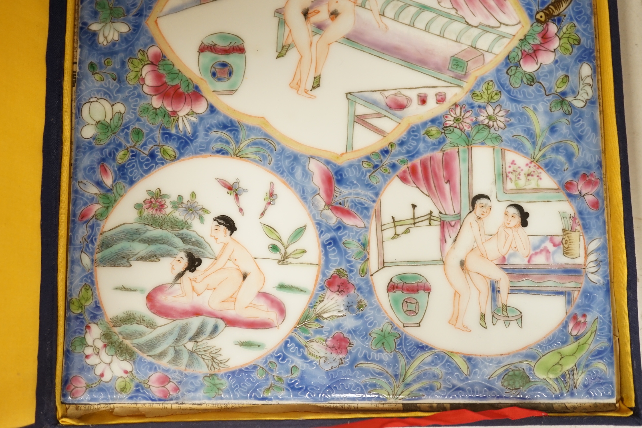 A cased Chinese enamelled porcelain erotic tile, 25cm wide, 36.5cm high